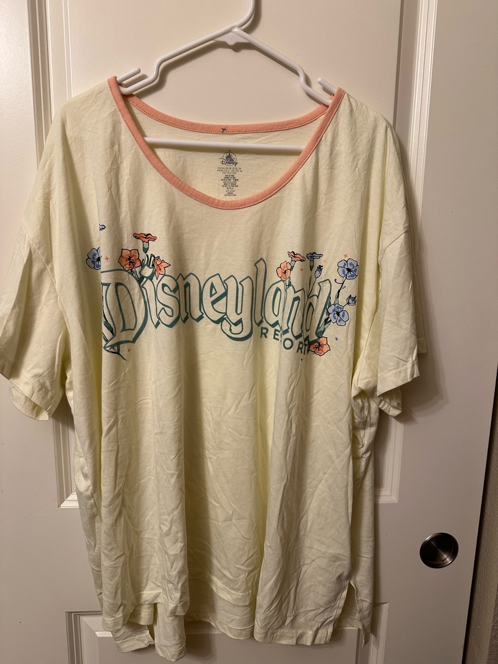Women’s Disney Cream Tee with Floral Logo and Peach Trim